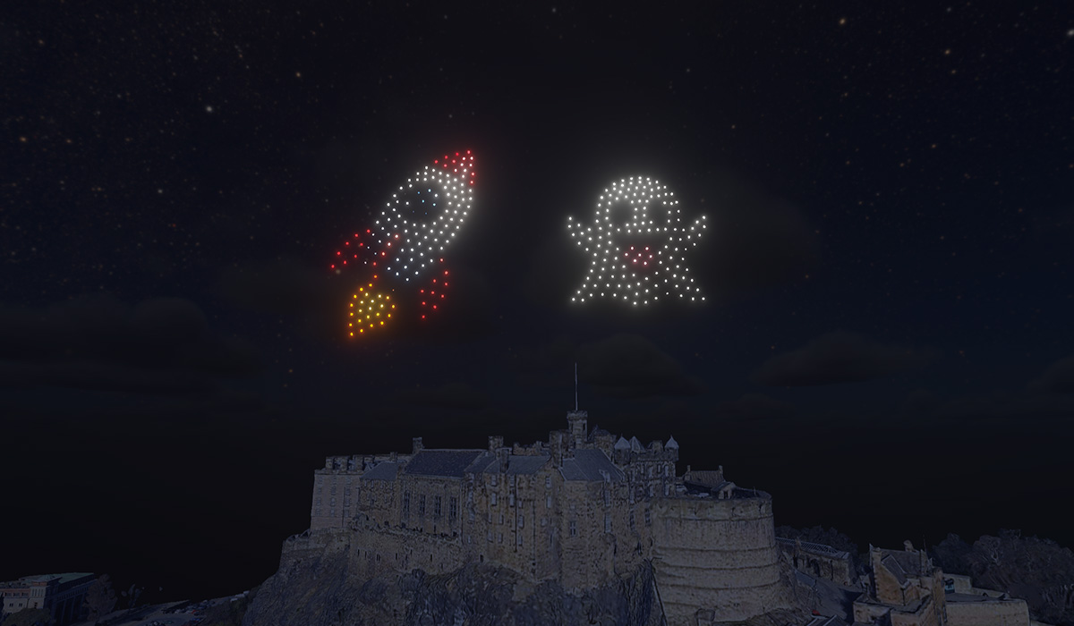 An emoji rocket and ghost made from 300 drones